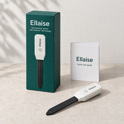 Ellaise soil moisture sensor in front of its box, with the quick start guide