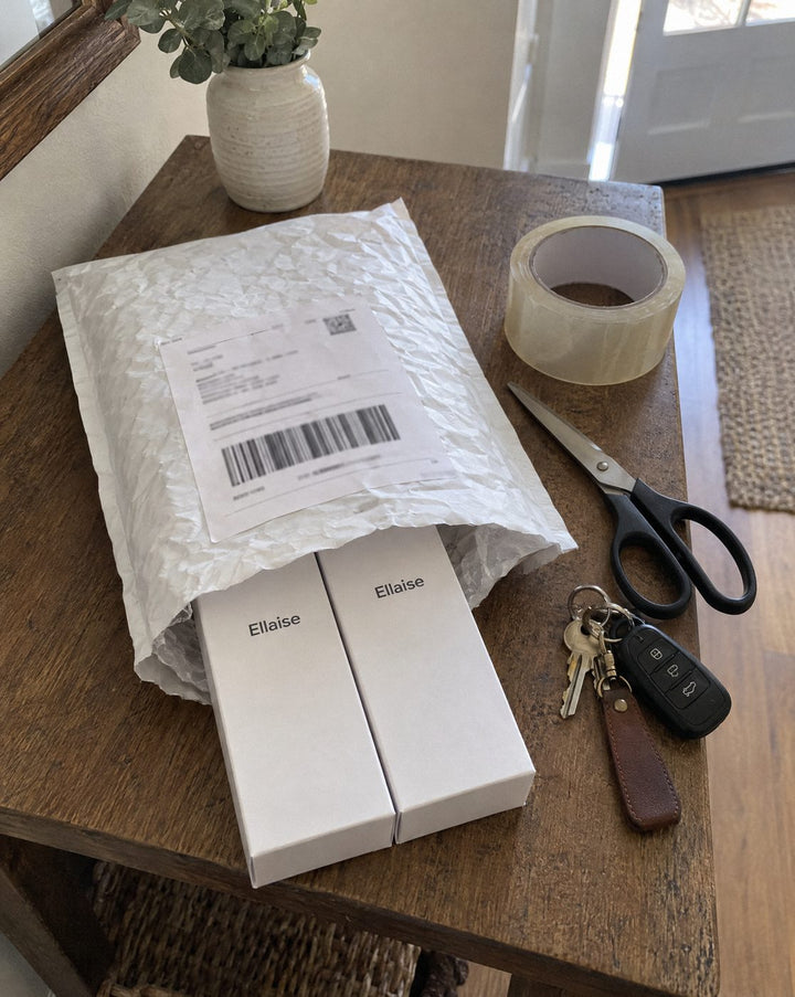 Two Ellaise boxes in a padded envelope with a prepaid label on it.